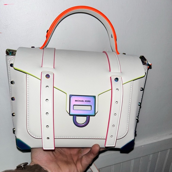 This is a Michael Kors Manhattan Medium Satchel. It has never been used. - Picture 2 of 3